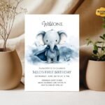 Watercolor elephant first birthday invitation with neutral decor.